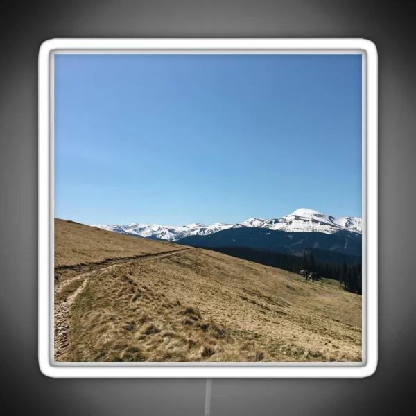 Snowy Mountain Peaks And Forest Landscape On The RGB Neon Sign