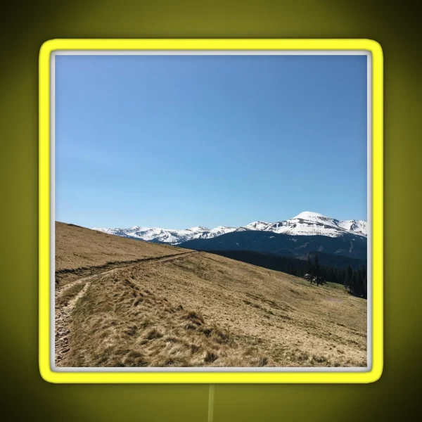 Snowy Mountain Peaks And Forest Landscape On The RGB Neon Sign