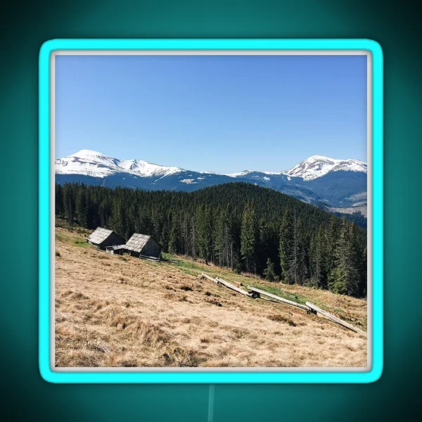 Snowy Mountain Peaks And Forest Landscape On RGB Neon Sign