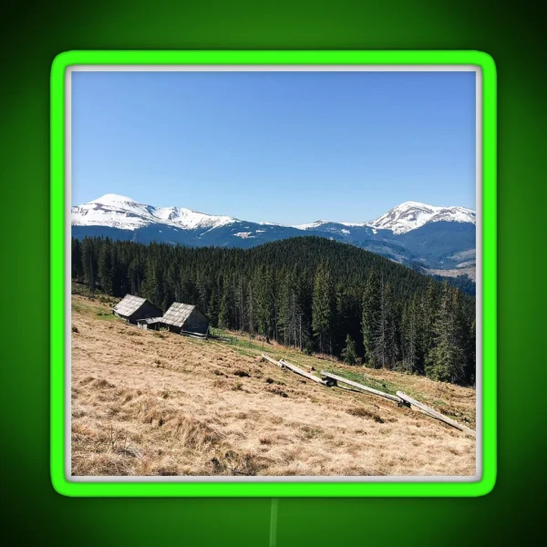 Snowy Mountain Peaks And Forest Landscape On RGB Neon Sign