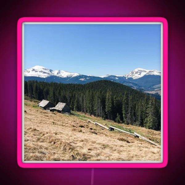 Snowy Mountain Peaks And Forest Landscape On RGB Neon Sign
