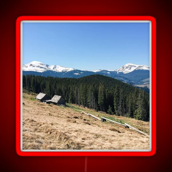 Snowy Mountain Peaks And Forest Landscape On RGB Neon Sign