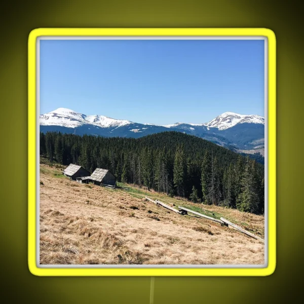 Snowy Mountain Peaks And Forest Landscape On RGB Neon Sign