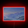 Neon-lit snowy mountain peaks at dusk