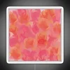 Soft pink rose bouquet against a neon-lit abstract background with vibrant RGB colors.