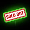 rgb neon sign displaying sold out in vibrant green colors.