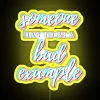 A vibrant, neon-lit sign with bold, yellow lettering reading 'Someone has to be a bad example'