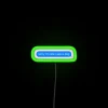 RGB neon sign with apologetic phrase in green, reading 'Sorry I'm late I saw a dog'