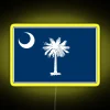 South Carolina state flag in neon lights on a yellow background.