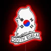 Map of South Korea with LED neon lights highlighting its geographical location.