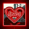 Neon-lit Spätzle sign in bold red colors, reflecting off wet pavement.