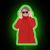 Speaker Pelosi under a neon green sign with RGB colors