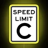 Neon speed limit sign with yellow background and bold black numbers.