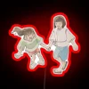Spirited Away characters Chihiro and Haku standing in front of a vibrant RGB neon sign