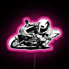 Sport bike cornering technique, neon-lit street scene with pink highlights