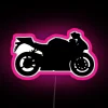 Neon-lit sport bike silhouette on a pink background, highlighting its sleek design.