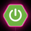 Neon pink Spring Boot logo on a city sign backdrop.