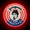 Neon presidential campaign sign with Springsteen's name in bold, colorful letters.
