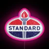 Neon vintage Standard Oil logo, 1950s advertisement sign in pink colors.