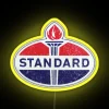 Vintage Standard Oil logo with neon signs in bright yellow and RGB colors.