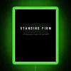 Neon sign with green letters reading 'Standing Firm'