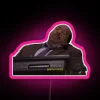 Neon sign with Stanley Hudson's name in bold pink letters against a dark background.