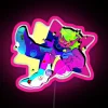 Neon pink star-shaped sign against a dark background.