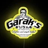 Star Trek Deep Space Nine Neon Sign featuring Garak's tailor shop logo in RGB colors.