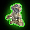 Elf statue with neon lights standing on a rock, depicted with exaggerated facial features.