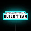 Team of professionals from Stellar Firma in front of a dark, RGB-lit neon sign in a futuristic setting.