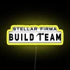 Neon sign featuring a stylized firm logo on a dark background with RGB lighting effects.