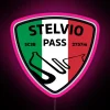 Motorcyclist navigating Stelvio Pass with a bright pink LED neon sign installed on their vehicle.