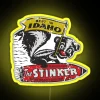 Neon sign with yellow letters reading 'Stinker Gas'