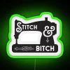 Neon sign featuring a sewing machine in a green color scheme, with vibrant RGB lighting.