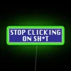 Neon sign with colorful letters spelling out a warning about excessive clicking on unnecessary things.