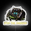 Neon sign featuring a cute jumping spider in stop-motion style.