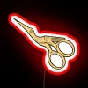 Neon sign with stork, scissors, gold, LED lights, and RGB glow