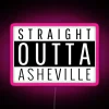 Neon pink sign reading 'Straight Outta Asheville, NC' in bold RGB letters.