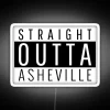 Neon sign reading 'Straight Outta Asheville' in vibrant RGB colors, reflecting the city's eclectic personality.