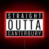 Neon sign reading 'Straight Out of Canterbury' in bold, colorful letters.
