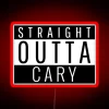 A vibrant neon sign reading "Straight Outta Cary" in a stylized font, with the colors of the American flag incorporated in...