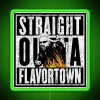 Neon sign reading 'Straight Out of Flavortown' in colorful, bold letters with green accents.