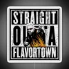 Neon sign reading "Straight Out of Flavortown" in bold, colorful letters.