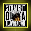 Neon sign reading 'Straight Outta Flavortown' in bold yellow letters on a dark background.
