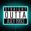 Retro neon sign reading 'Straight Outta July 1993' in bold, blue letters.