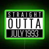 Neon sign reading 'Straight Outta July 1993' with green glow, vintage aesthetic.