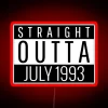 Neon sign reading 'Straight Outta July 1993' in bold red letters against a dark background.