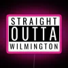 Neon sign featuring a bold, pink "Straight Outta Wilmington" logo on a dark background.