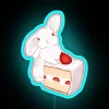 Neon strawberry bunny sign in vibrant colors
