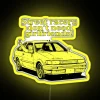 Neon street sign with Japanese kanji characters reading 'Street Racers Don't Need Girlfriends'